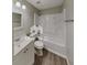 Bathroom featuring a white vanity, toilet, and shower-tub combo with matching finishes and fixtures at 119 Michelle Dr, Mcdonough, GA 30252
