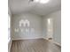 Bright bedroom features neutral walls, modern flooring, and a window at 119 Michelle Dr, Mcdonough, GA 30252