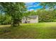 Spacious backyard featuring a well-maintained lawn and a play area, perfect for outdoor activities at 236 Fairview Dr, Dallas, GA 30157