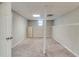 Unfinished basement featuring painted cinder block, carpeted floors, and painted white trim at 236 Fairview Dr, Dallas, GA 30157