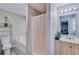 Bathroom featuring modern vanity with sink, toilet, tub with shower, and overhead lighting at 236 Fairview Dr, Dallas, GA 30157