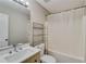 Bathroom featuring modern vanity with sink, toilet, tub with shower and shelving for storage at 236 Fairview Dr, Dallas, GA 30157