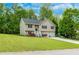 Charming split-level home with a two-car garage and a well-maintained lawn at 236 Fairview Dr, Dallas, GA 30157