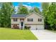 Charming split-level home with a two-car garage and a well-maintained lawn at 236 Fairview Dr, Dallas, GA 30157