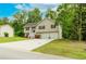 Charming split-level home with a two-car garage and a well-maintained lawn at 236 Fairview Dr, Dallas, GA 30157