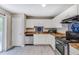 Cozy kitchen with white cabinets, stainless steel appliances, and wood-look vinyl flooring at 236 Fairview Dr, Dallas, GA 30157