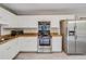 Cozy kitchen with white cabinets, stainless steel appliances, and wood-look vinyl flooring at 236 Fairview Dr, Dallas, GA 30157