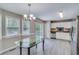 Bright eat-in kitchen with stainless steel appliances, tile backsplash, and updated lighting at 236 Fairview Dr, Dallas, GA 30157
