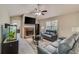 Inviting living room with vaulted ceiling, a brick fireplace, and stylish decor at 236 Fairview Dr, Dallas, GA 30157
