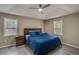 Spacious main bedroom with trey ceiling, fan, and large window for natural light and a wood-look floor at 236 Fairview Dr, Dallas, GA 30157