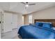Main bedroom features trey ceiling, fan, large windows for natural light, closet access, and wood-look floor at 236 Fairview Dr, Dallas, GA 30157