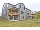 Multi-level backyard featuring a covered deck, a patio area, and green space perfect for outdoor entertaining at 3305 Morgan Rd, Buford, GA 30519