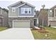 Charming two-story home featuring a stone facade, two-car garage, and well-maintained front lawn at 3305 Morgan Rd, Buford, GA 30519