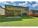 Spacious backyard featuring a covered patio, perfect for outdoor entertaining and relaxation at 4610 Point Rock Dr, Buford, GA 30519