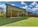 Expansive backyard offers a serene retreat with a covered patio and lush green lawn at 4610 Point Rock Dr, Buford, GA 30519