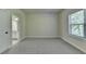 Bedroom with neutral carpet, white trim, and an attached bathroom at 4610 Point Rock Dr, Buford, GA 30519