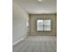 Spacious bedroom with neutral carpeting, window view and closet access at 4610 Point Rock Dr, Buford, GA 30519