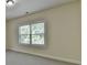 Bedroom view featuring a window with blinds, neutral walls, and carpet flooring at 4610 Point Rock Dr, Buford, GA 30519