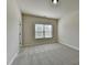 Bright bedroom with plush carpeting and a window offering natural light at 4610 Point Rock Dr, Buford, GA 30519