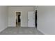 Bedroom featuring neutral carpeting and access to bathroom and closet at 4610 Point Rock Dr, Buford, GA 30519