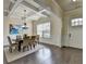 Dining room features a coffered ceiling, hardwood floors, and large windows for ample lighting at 4610 Point Rock Dr, Buford, GA 30519