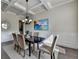 Dining room with coffered ceiling, chair rail molding, hardwood floors and neutral color palette at 4610 Point Rock Dr, Buford, GA 30519