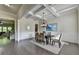 Open-concept dining room showcases hardwood floors, chair rail molding, and coffered ceilings at 4610 Point Rock Dr, Buford, GA 30519