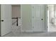Hallway with views of the staircase, bedroom and a closet at 4610 Point Rock Dr, Buford, GA 30519