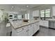 Kitchen island featuring granite countertops, seating, and an open floor plan at 4610 Point Rock Dr, Buford, GA 30519