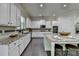 Beautiful kitchen featuring white cabinets, stainless steel appliances, and granite countertops at 4610 Point Rock Dr, Buford, GA 30519
