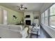 Inviting living room with fireplace, large windows for natural light, and stylish decor at 4610 Point Rock Dr, Buford, GA 30519