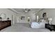 Large main bedroom with tray ceilings, carpet floors, and furniture features provides a comfortable retreat at 4610 Point Rock Dr, Buford, GA 30519