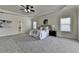 Inviting main bedroom with tray ceilings, carpet floors, and windows for natural light is a perfect retreat at 4610 Point Rock Dr, Buford, GA 30519