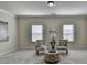 Bright sitting area with comfortable chairs, carpet, and windows features a modern design at 4610 Point Rock Dr, Buford, GA 30519