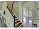 Stairway featuring wood stairs and white railing at 4610 Point Rock Dr, Buford, GA 30519