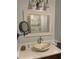 Elegant bathroom featuring a stylish sink and framed mirror at 3014 Echols Rd, Cumming, GA 30041
