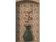Bathroom niche featuring decorative tile, a modern vase and an elegant flower stem at 3014 Echols Rd, Cumming, GA 30041