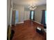 Bright bedroom featuring hardwood floors, double closets and a modern sputnik light fixture at 3014 Echols Rd, Cumming, GA 30041