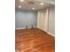 Well-lit bedroom featuring wood floors and closet at 3014 Echols Rd, Cumming, GA 30041