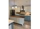 Bright kitchen features a kitchen island, stainless steel appliances, and ample cabinet space at 3014 Echols Rd, Cumming, GA 30041