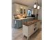 Charming kitchen featuring blue cabinets, white countertops, stainless steel appliances, and a kitchen island with a wooden top at 3014 Echols Rd, Cumming, GA 30041