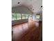 Spacious living room with wood floors, natural light, and recessed lighting at 3014 Echols Rd, Cumming, GA 30041
