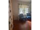 Cozy sitting room with hardwood floors and accent chairs at 3014 Echols Rd, Cumming, GA 30041