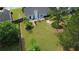Aerial view showcasing a home with a sprawling backyard featuring a patio and lush landscaping at 5298 Autumn Run Dr, Powder Springs, GA 30127