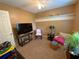 Cozy room featuring carpeted floors, a ceiling fan and small furniture at 5298 Autumn Run Dr, Powder Springs, GA 30127