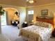 Spacious bedroom with sitting area, tray ceilings, and a large window for natural light at 5298 Autumn Run Dr, Powder Springs, GA 30127