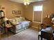 Cozy bedroom with a daybed, dresser, bookshelf, and a window for natural light at 5298 Autumn Run Dr, Powder Springs, GA 30127