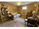 Bedroom with daybed, desk, and shelves, lit by ceiling fan at 5298 Autumn Run Dr, Powder Springs, GA 30127