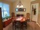 Charming dining room with a round wooden table, decorative mirror, and a warm, inviting ambiance for meals at 5298 Autumn Run Dr, Powder Springs, GA 30127