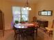 Elegant dining room featuring a chandelier and seating for six at 5298 Autumn Run Dr, Powder Springs, GA 30127